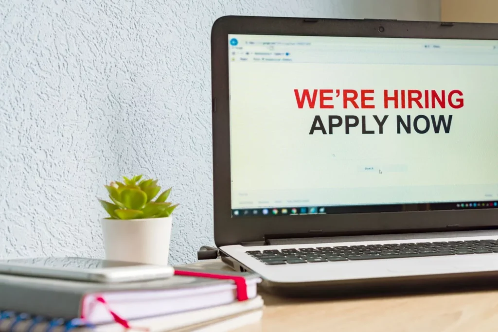 computer with "We're Hiring" on the screen