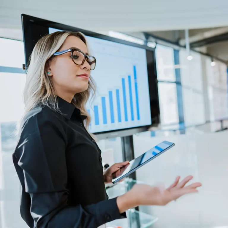 woman presenting a graph showing a positive ROI