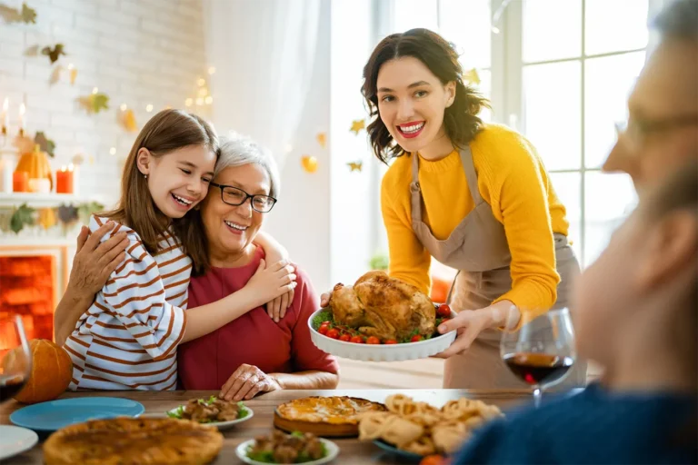 Woman holding turkey at family dinner