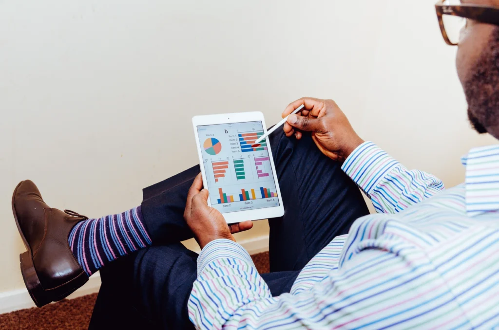 man looking at analytics on ipad