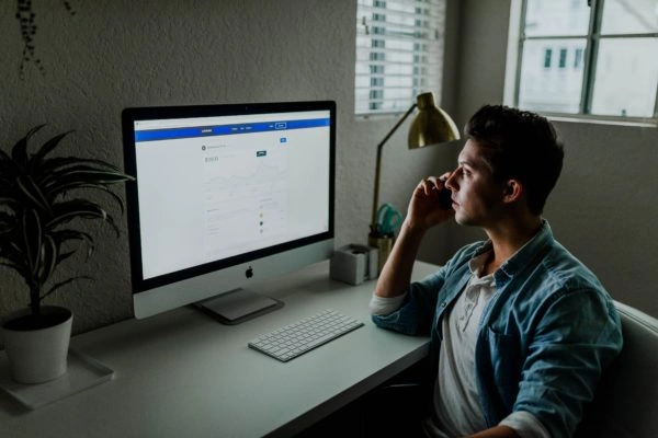 man looking at computer