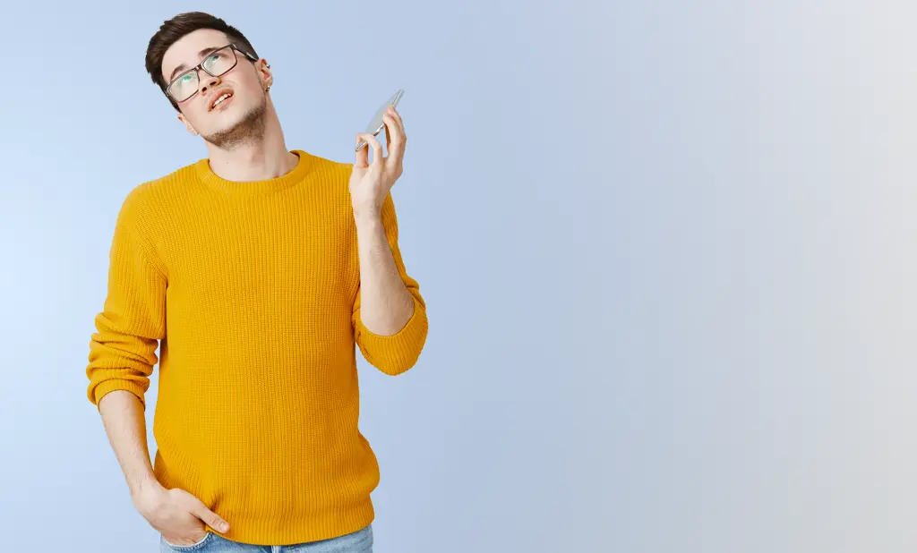 man fed up and holding phone in hand