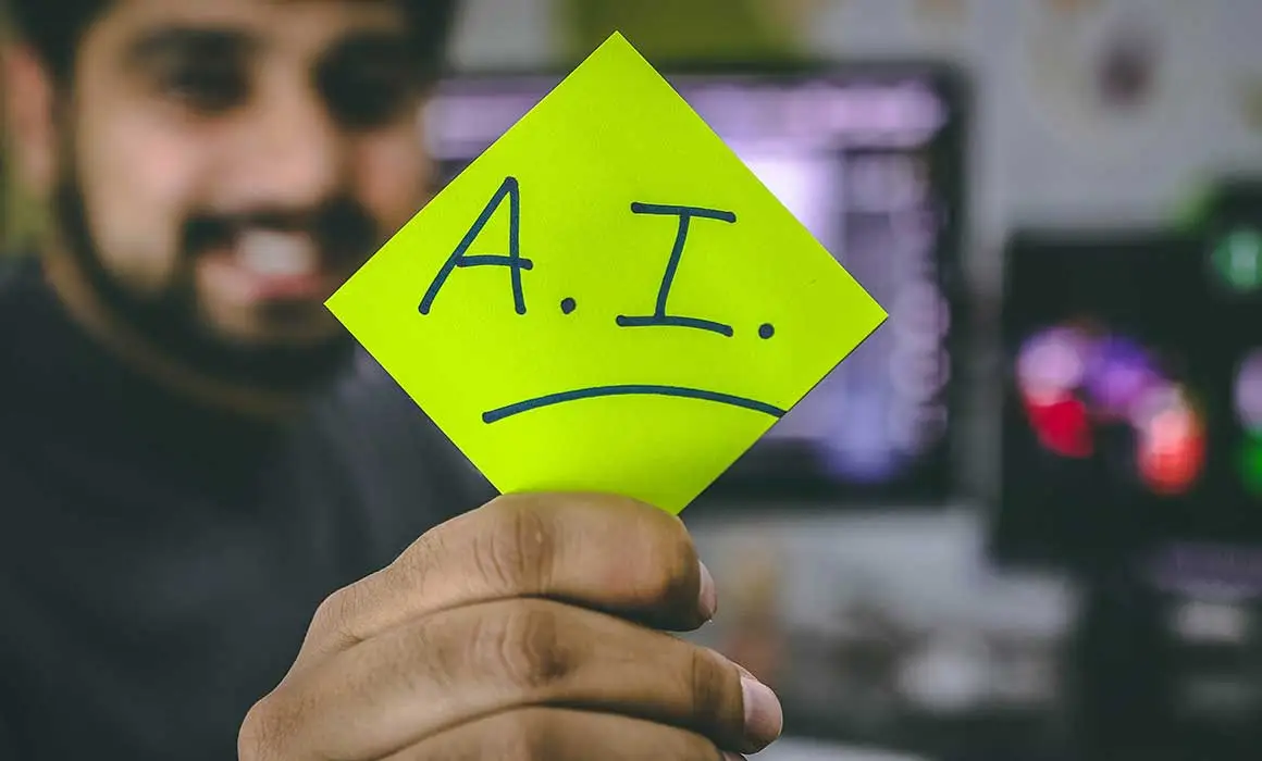 person holding sticky note that says A.I.