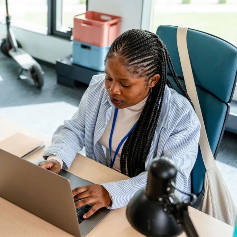 woman typing on laptop