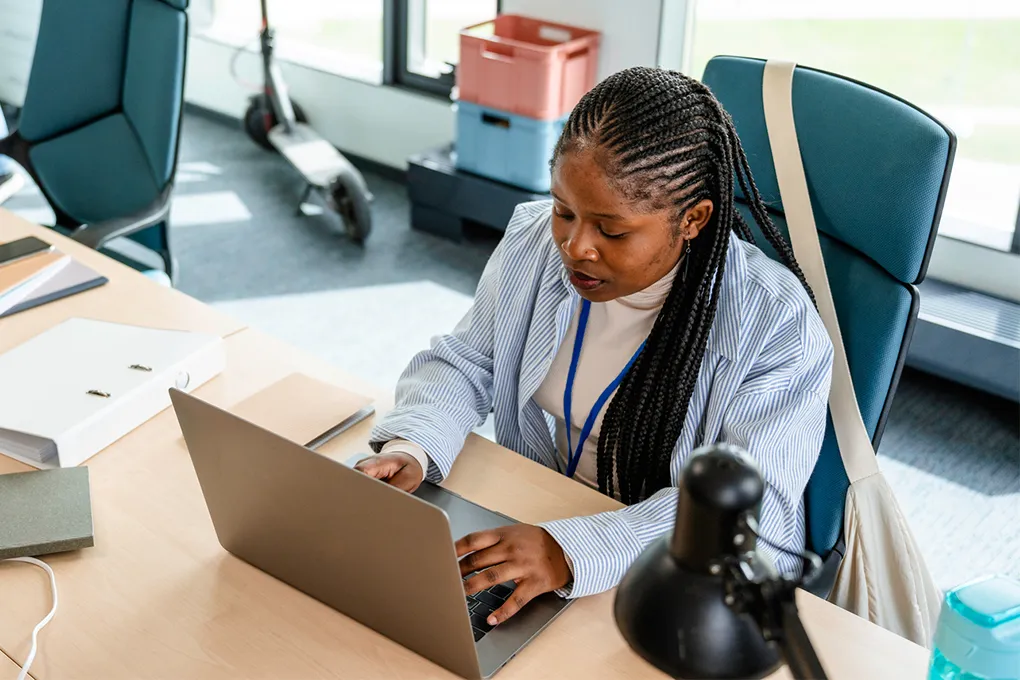 woman typing on laptop