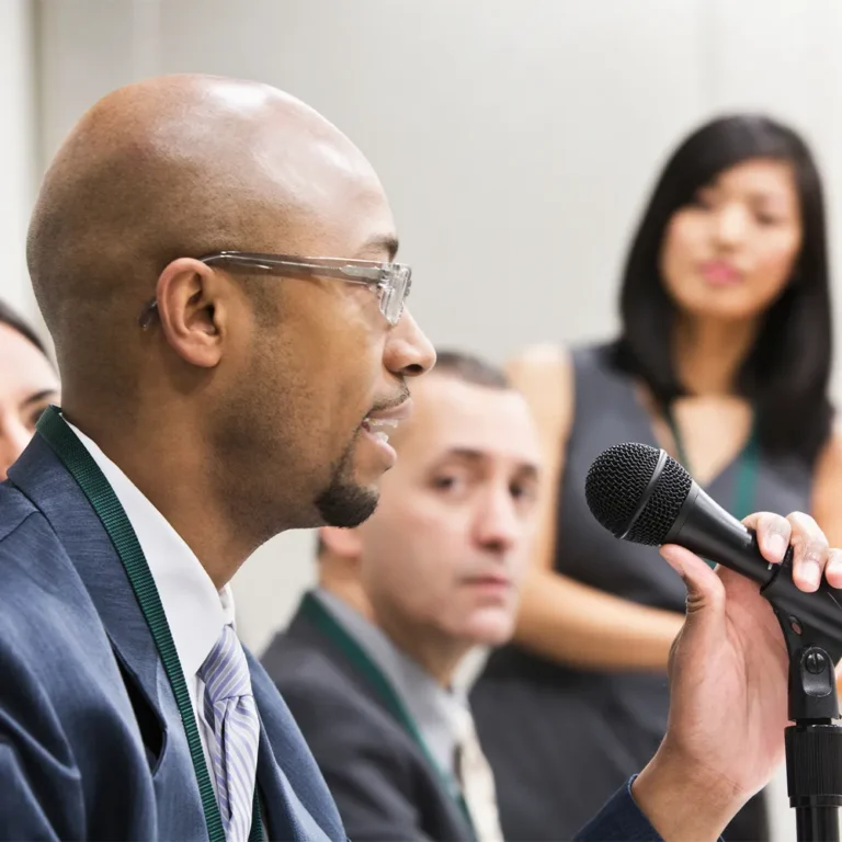 government official speaking into a microphone