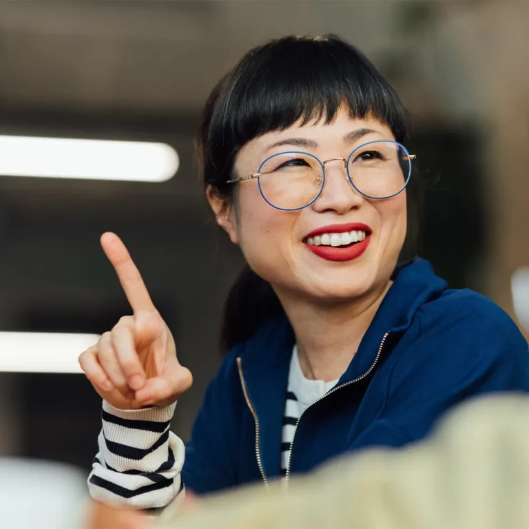 woman smiling and pointing